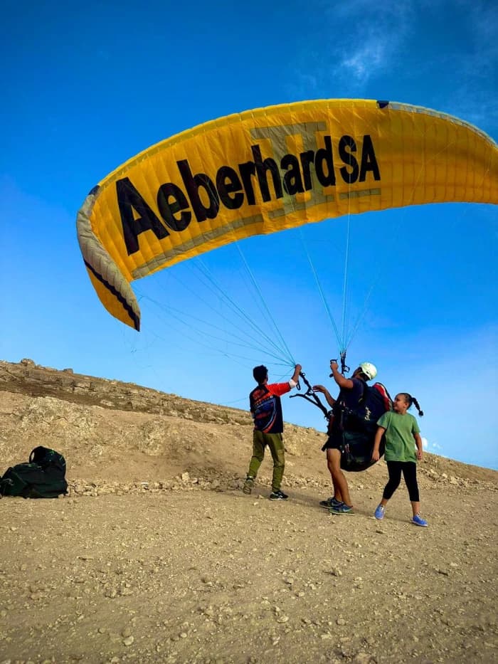 Team of paragliders preparing for flight in Marrakech